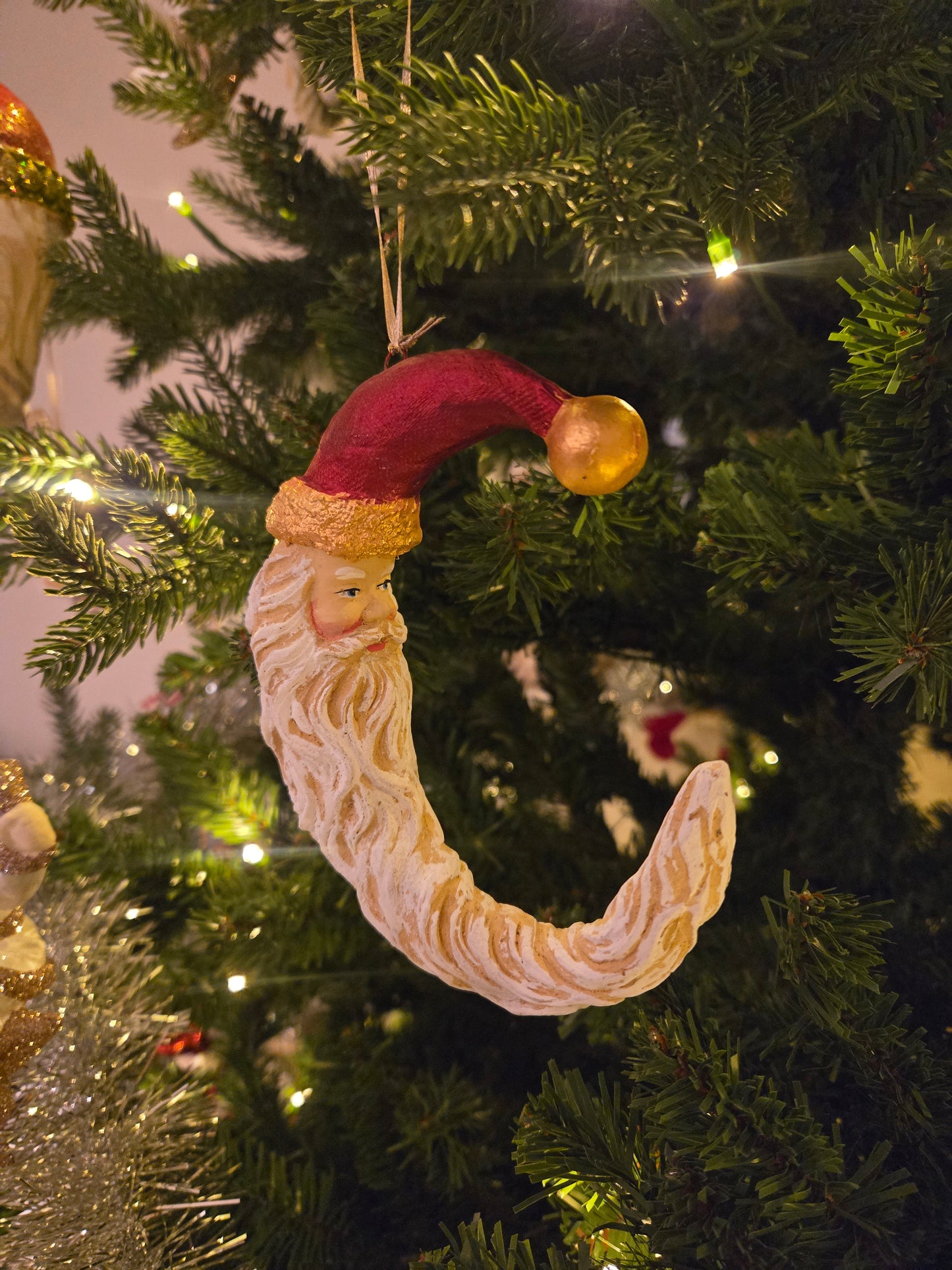 Cresent Santa beard red hat gold